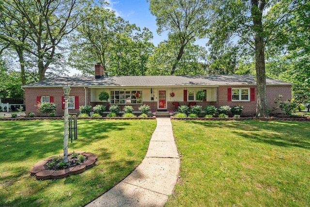 801 New York Ave, Absecon, NJ 08201 - view of front of home with brick siding, a front lawn, a chimney, and a porch