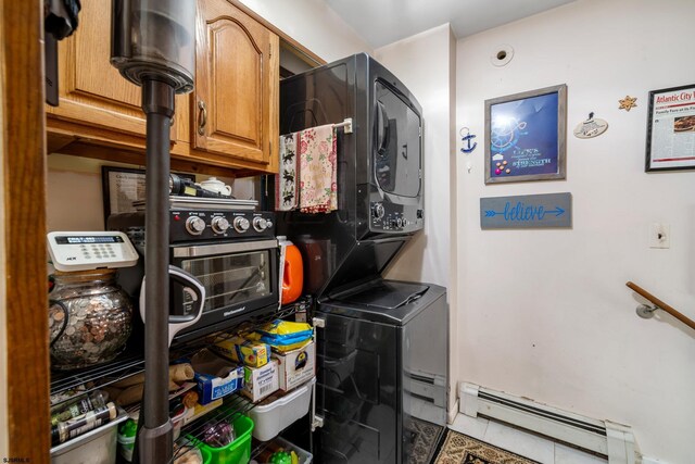 801 New York Ave, Absecon, NJ 08201 - washroom with stacked washer / dryer, a baseboard radiator, and tile patterned flooring