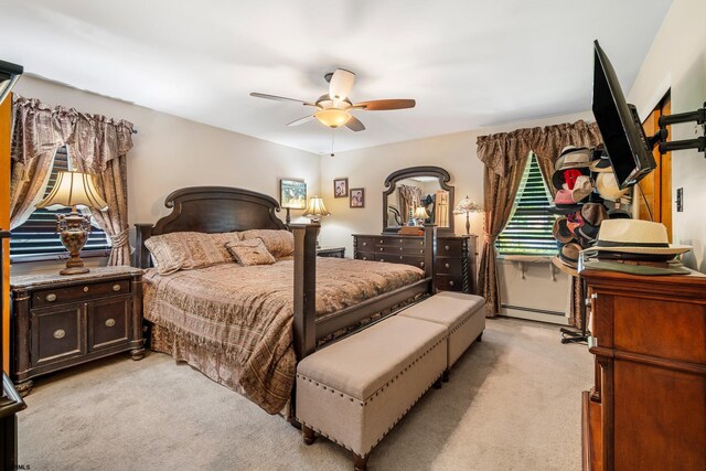 801 New York Ave, Absecon, NJ 08201 - bedroom featuring light carpet, a baseboard heating unit, and ceiling fan