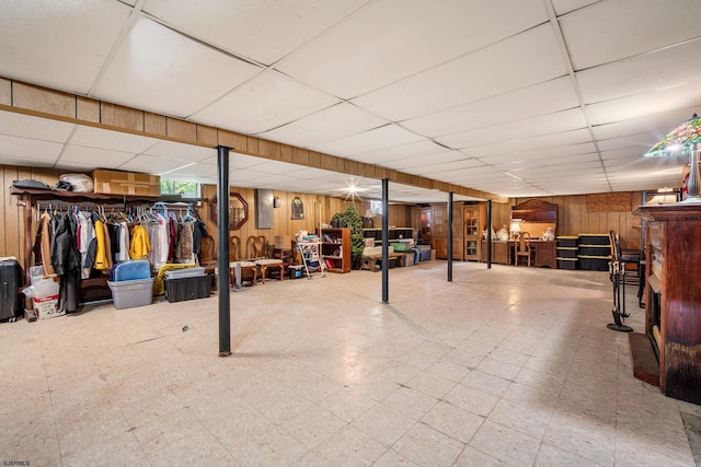 801 New York Ave, Absecon, NJ 08201 - basement featuring tile patterned floors, wooden walls, and a drop ceiling