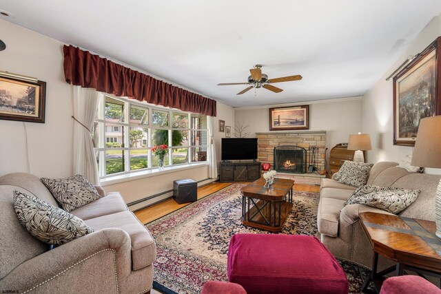 801 New York Ave, Absecon, NJ 08201 - living room featuring a baseboard radiator, a ceiling fan, wood finished floors, a fireplace, and baseboard heating