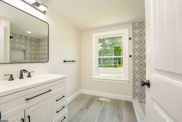 1013 New Rd, Northfield, NJ 08225 - full bathroom featuring baseboards, vanity, wood finished floors, and a shower