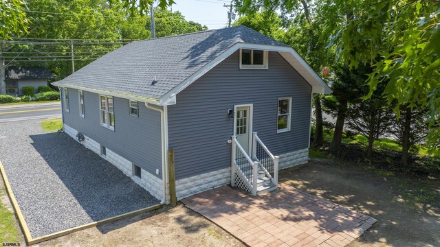 1013 New Rd, Northfield, NJ 08225 - back of house featuring roof with shingles and entry steps