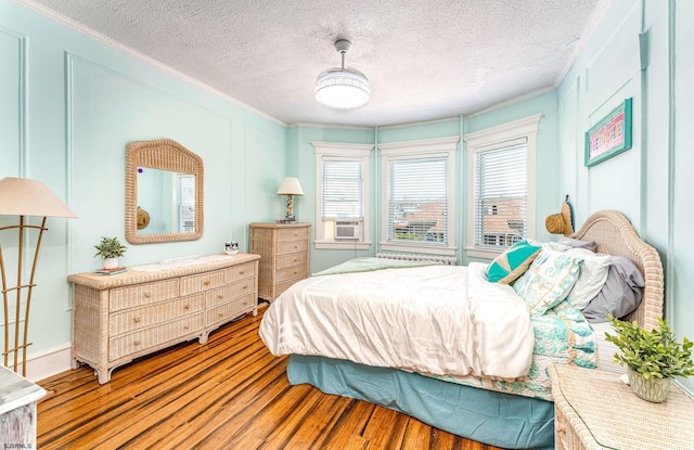 5003 Atlantic Ave Unit C04, Ventnor, NJ 08406 - bedroom with wood finished floors, a textured ceiling, and crown molding