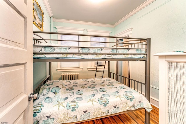 5003 Atlantic Ave Unit C04, Ventnor, NJ 08406 - bedroom featuring radiator, crown molding, wood finished floors, and a textured wall