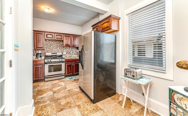 5003 Atlantic Ave Unit C04, Ventnor, NJ 08406 - kitchen featuring fridge with ice dispenser, gas range, decorative backsplash, baseboards, and light stone finish flooring