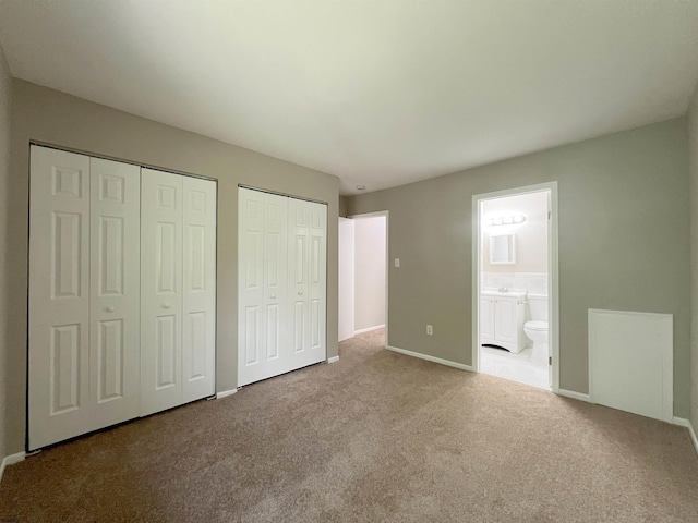 34 Vail Ct Unit 34, Galloway Township, NJ 08205 - unfurnished bedroom featuring two closets, carpet flooring, baseboards, and ensuite bath
