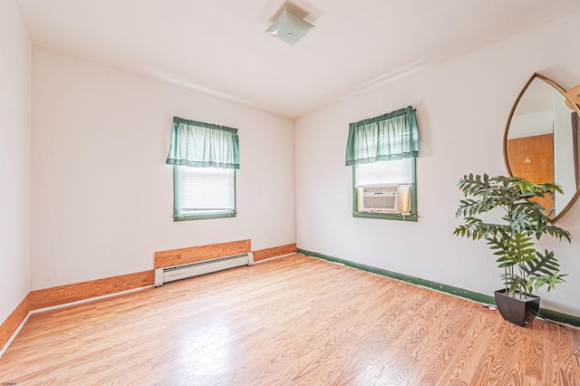 304 N Annapolis Ave, Atlantic City, NJ 08401 - empty room with a baseboard heating unit, plenty of natural light, wood finished floors, and cooling unit