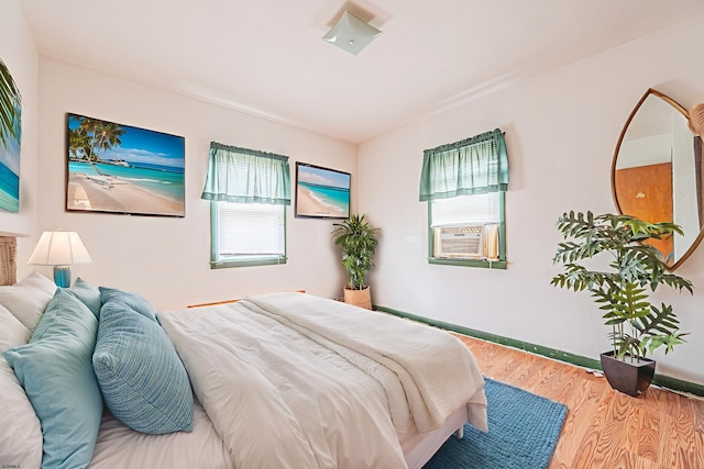 304 N Annapolis Ave, Atlantic City, NJ 08401 - bedroom featuring multiple windows, cooling unit, wood finished floors, and baseboards