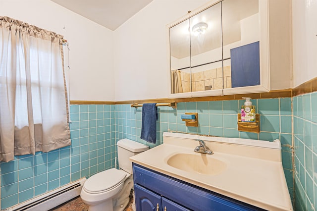 304 N Annapolis Ave, Atlantic City, NJ 08401 - full bathroom with a baseboard heating unit, tile walls, vanity, toilet, and a wainscoted wall