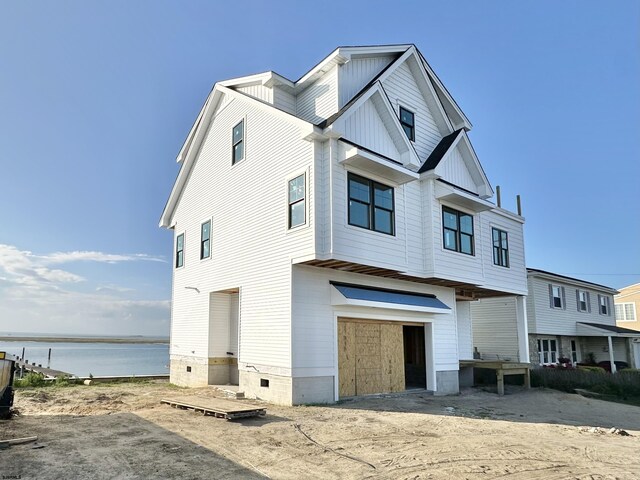 4705 Atlantic Brigantine Blvd, Brigantine, NJ 08203 - view of front of home featuring an attached garage, a water view, and board and batten siding