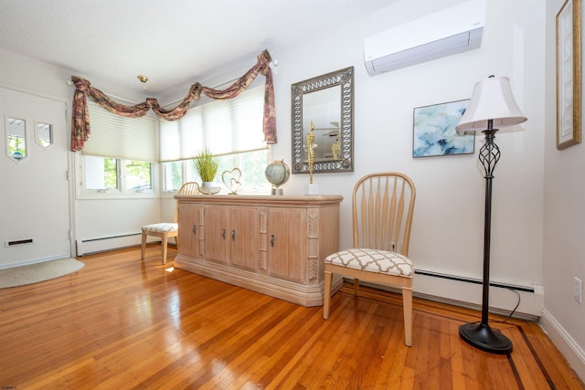 14 N Cambridge Ave, Ventnor, NJ 08406 - living area with an AC wall unit, a baseboard radiator, light wood-type flooring, and baseboards