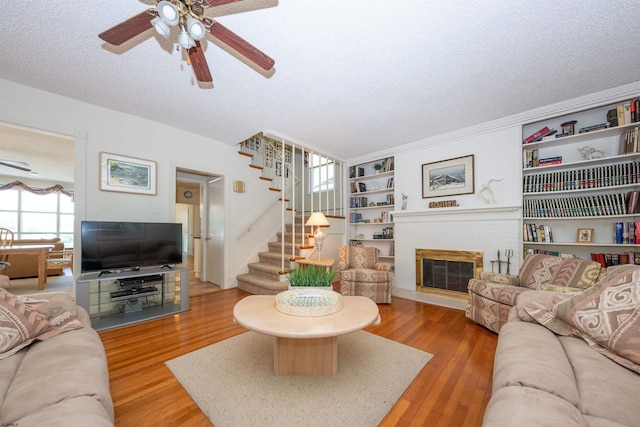 14 N Cambridge Ave, Ventnor, NJ 08406 - living area with a ceiling fan, stairway, a textured ceiling, and wood finished floors