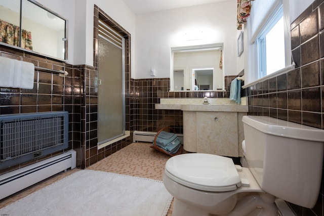 14 N Cambridge Ave, Ventnor, NJ 08406 - full bath featuring tile walls, toilet, a baseboard heating unit, a shower stall, and wainscoting