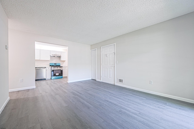 161 Sussex Pl Unit 161, Galloway Township, NJ 08205 - unfurnished living room featuring wood finished floors, baseboards, and a textured ceiling