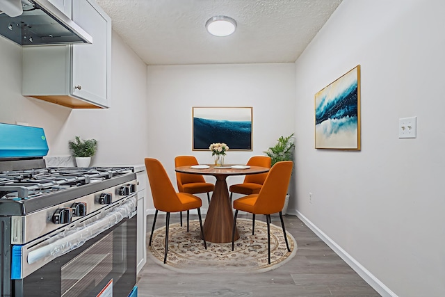161 Sussex Pl Unit 161, Galloway Township, NJ 08205 - dining space with a textured ceiling, light wood-style flooring, and baseboards