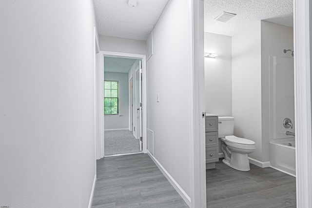 161 Sussex Pl Unit 161, Galloway Township, NJ 08205 - corridor featuring wood finished floors, a textured ceiling, and baseboards