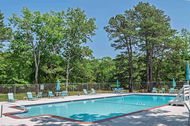 161 Sussex Pl Unit 161, Galloway Township, NJ 08205 - community pool featuring a patio area and view of scattered trees
