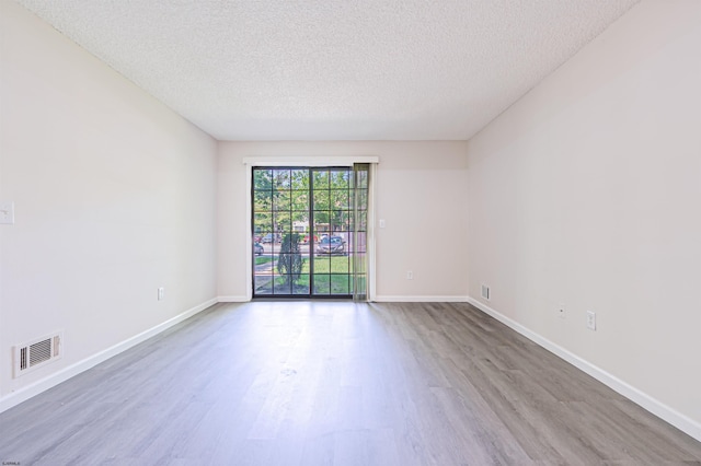 161 Sussex Pl Unit 161, Galloway Township, NJ 08205 - spare room with a textured ceiling, wood finished floors, and baseboards