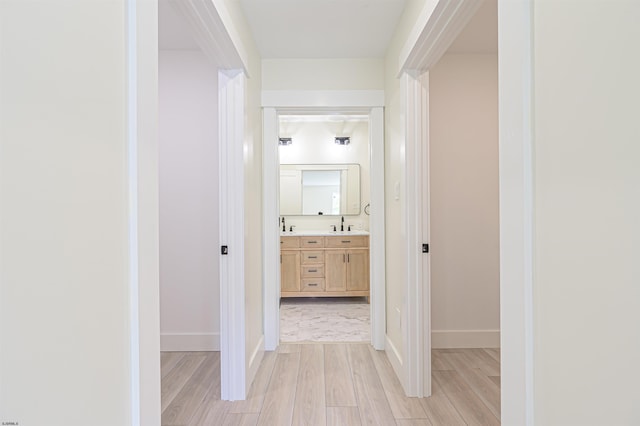 205 Valley Ave, Hammonton, NJ 08037 - hallway with light wood-type flooring and a sink