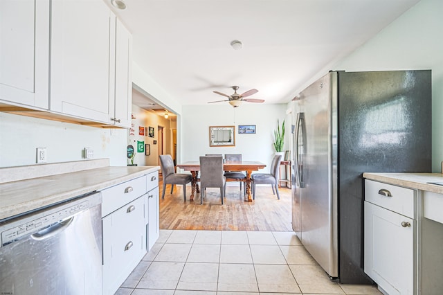 605 W Mill Rd, Northfield, NJ 08225 - kitchen featuring stainless steel appliances, ceiling fan, light countertops, light tile patterned floors, and white cabinets