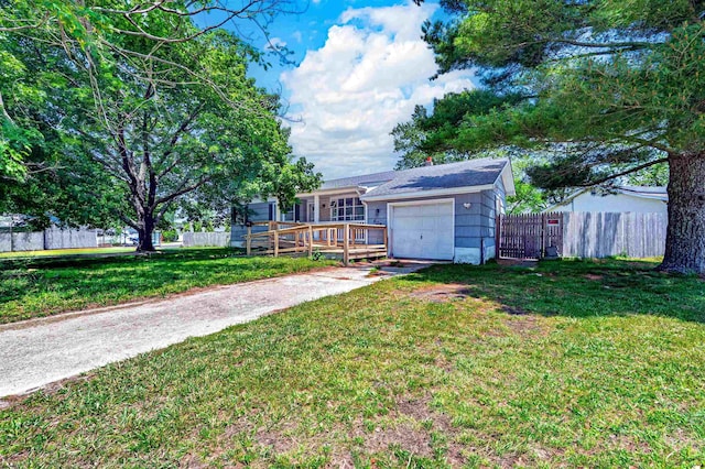 605 W Mill Rd, Northfield, NJ 08225 - view of yard with concrete driveway, a garage, and a gate