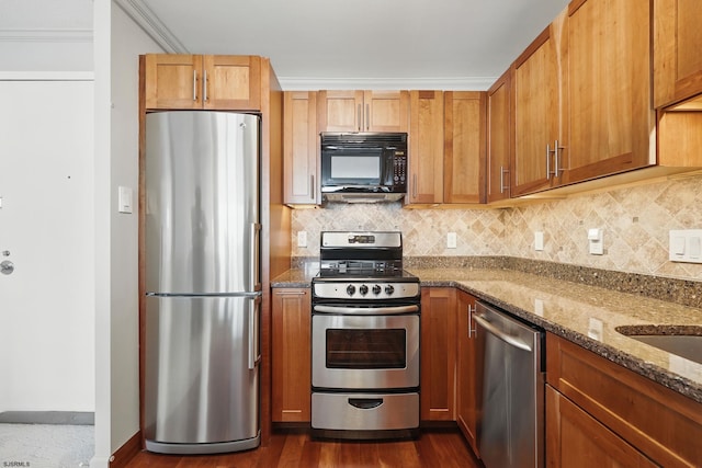 111 S 16th Ave Unit 605, Longport, NJ 08403 - kitchen featuring stainless steel appliances, stone counters, tasteful backsplash, dark wood-style flooring, and brown cabinetry
