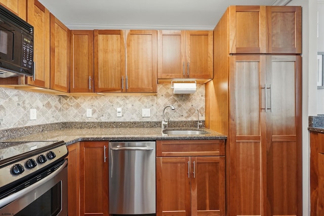 111 S 16th Ave Unit 605, Longport, NJ 08403 - kitchen with stainless steel appliances, tasteful backsplash, dark stone countertops, and brown cabinets