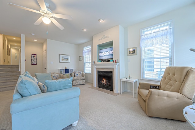 1130 Simpson Ave Unit 1, Ocean City, NJ 08226 - living room with light carpet, a tile fireplace, stairs, ceiling fan, and recessed lighting