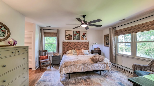 9 Lesley Ln, Northfield, NJ 08225 - bedroom featuring a baseboard radiator, wood finished floors, and ceiling fan