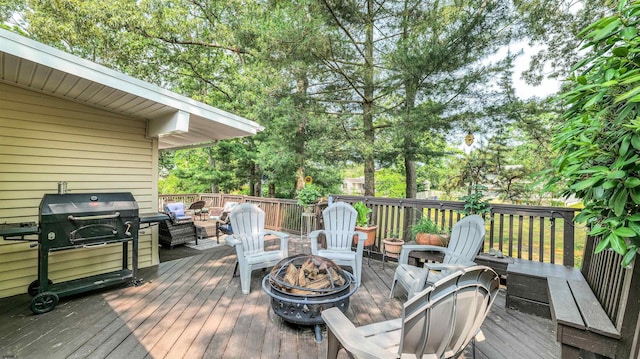 9 Lesley Ln, Northfield, NJ 08225 - wooden terrace with a fire pit and view of wooded area