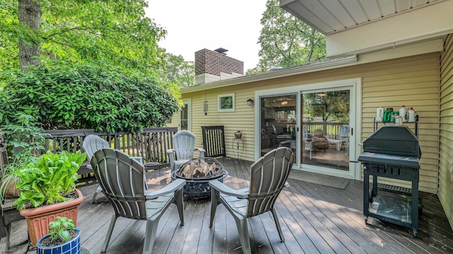 9 Lesley Ln, Northfield, NJ 08225 - wooden deck with an outdoor fire pit and area for grilling