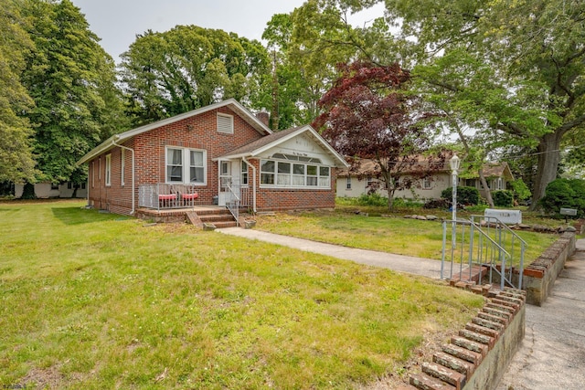 112 Kirklin Ave, Linwood, NJ 08221 - bungalow with brick siding, a front lawn, and a chimney