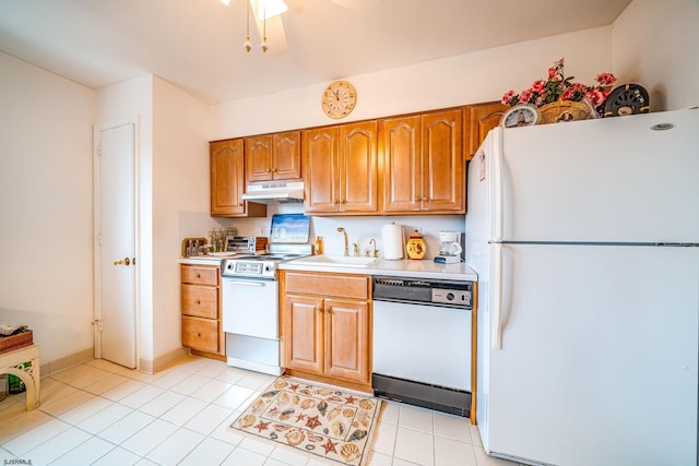 2137 Asbury Ave Unit 19, Ocean City, NJ 08226 - kitchen with white appliances, under cabinet range hood, light countertops, ceiling fan, and brown cabinetry