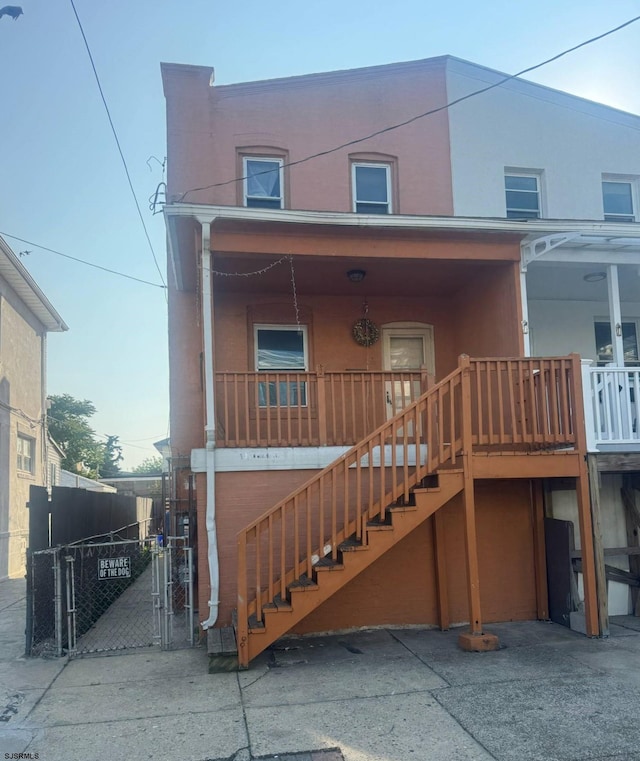 118 N Morris Ave, Atlantic City, NJ 08401 - view of front of house featuring a gate, stucco siding, and stairway