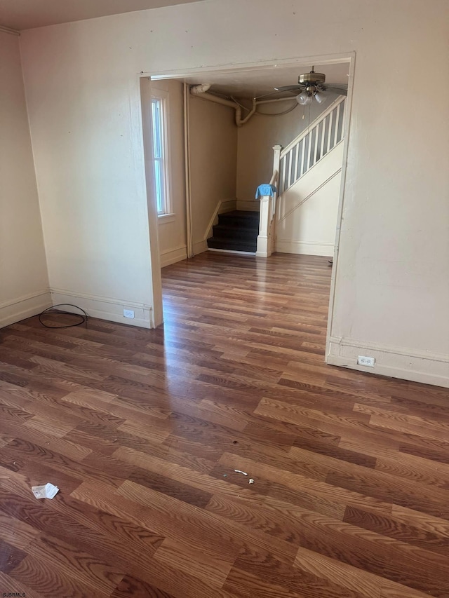 118 N Morris Ave, Atlantic City, NJ 08401 - empty room with wood finished floors, stairs, and a ceiling fan