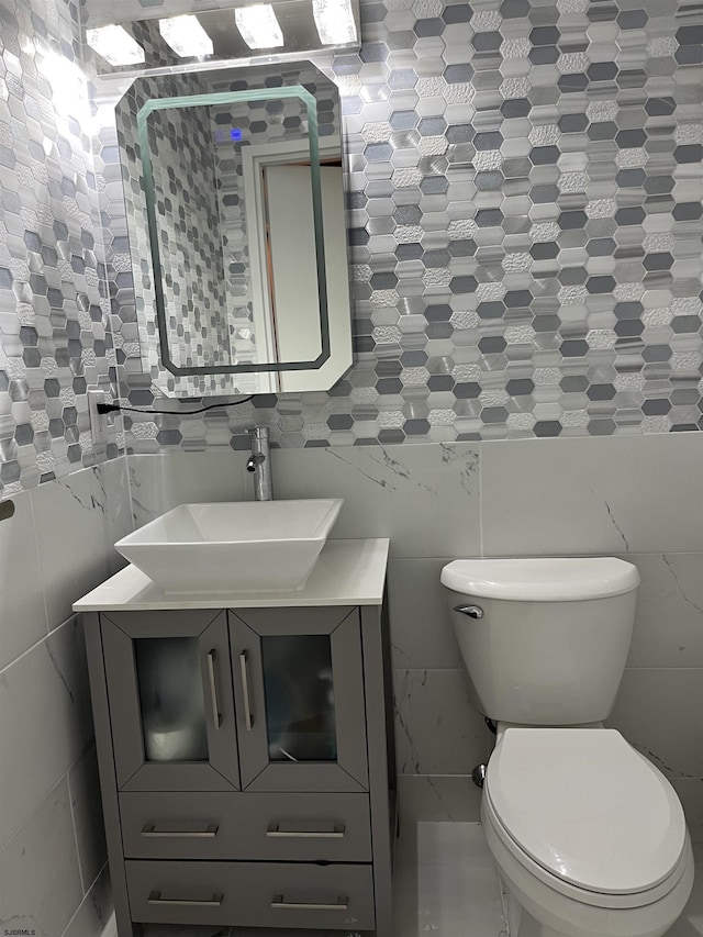 3101 Boardwalk Unit 2503-A Tower 1, Atlantic City, NJ 08401 - bathroom featuring tile walls, vanity, and tasteful backsplash