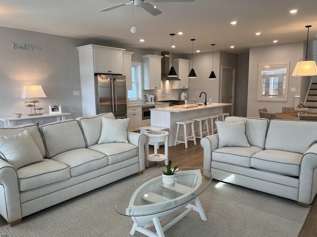 1755 Bay Ave, Ocean City, NJ 08226 - living room featuring a ceiling fan, wood finished floors, recessed lighting, and stairs