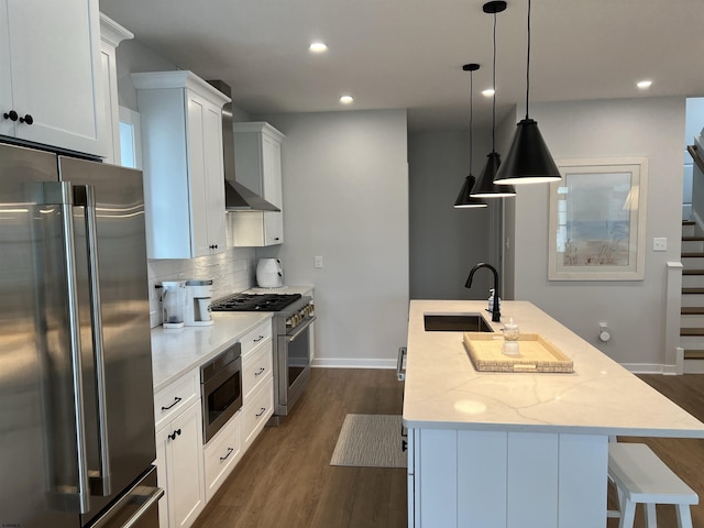 1755 Bay Ave, Ocean City, NJ 08226 - kitchen with high end appliances, wall chimney exhaust hood, recessed lighting, tasteful backsplash, and dark wood-type flooring