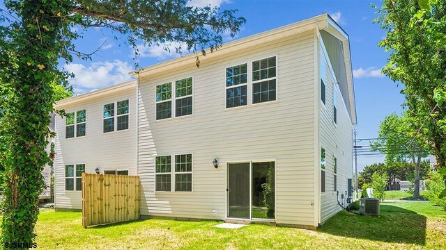 845 Broadway, West Cape May, NJ 08204 - rear view of house featuring a lawn