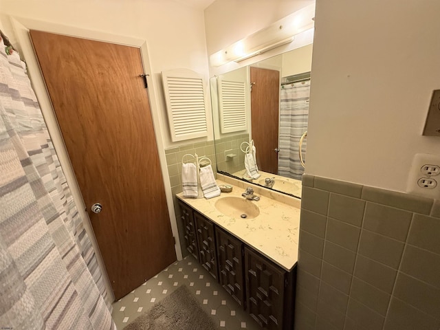 170 E Holly Ln Unit 170, Little Egg Harbor, NJ 08087 - full bathroom featuring tile walls, vanity, and wainscoting