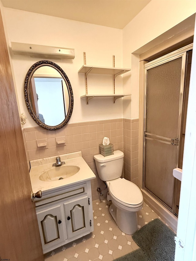 170 E Holly Ln Unit 170, Little Egg Harbor, NJ 08087 - bathroom with wainscoting, vanity, a stall shower, and tile walls