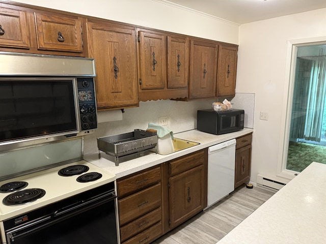 170 E Holly Ln Unit 170, Little Egg Harbor, NJ 08087 - kitchen with white dishwasher, range with electric stovetop, stainless steel microwave, black microwave, and light countertops