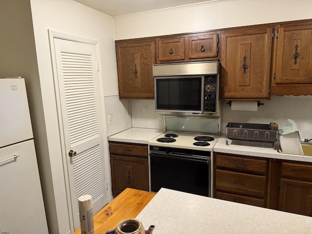 170 E Holly Ln Unit 170, Little Egg Harbor, NJ 08087 - kitchen with stainless steel microwave, electric range, and light countertops