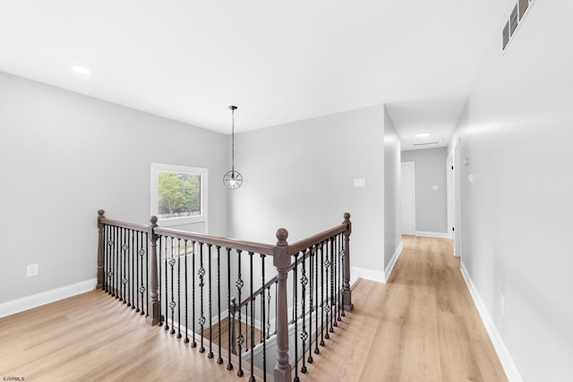 243 Wintergreen Ln, Penns Grove Borough, NJ 08069 - hallway featuring light wood-type flooring, an upstairs landing, and recessed lighting
