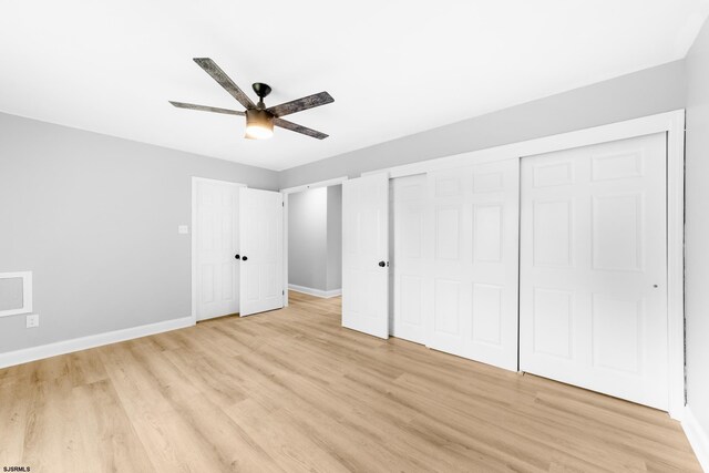 243 Wintergreen Ln, Penns Grove Borough, NJ 08069 - unfurnished bedroom with light wood-style floors, ceiling fan, and a closet