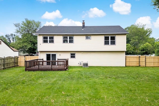 243 Wintergreen Ln, Penns Grove Borough, NJ 08069 - rear view of house with a chimney, a fenced backyard, and a deck