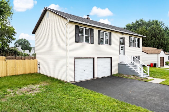 243 Wintergreen Ln, Penns Grove Borough, NJ 08069 - split foyer home featuring a chimney, driveway, and a garage