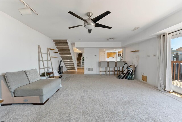 151 N Annapolis Ave Unit D, Atlantic City, NJ 08401 - carpeted living area featuring ceiling fan and stairs