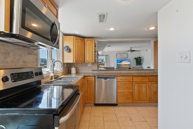 151 N Annapolis Ave Unit D, Atlantic City, NJ 08401 - kitchen with appliances with stainless steel finishes, ceiling fan, backsplash, light tile patterned floors, and recessed lighting